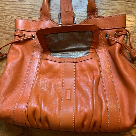 Cole Hahn orange handbag with fringe and silver hardware. - Picture 8 of 16